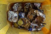 The Wider Image: Cash for trash: Indonesia village banks on waste recycling