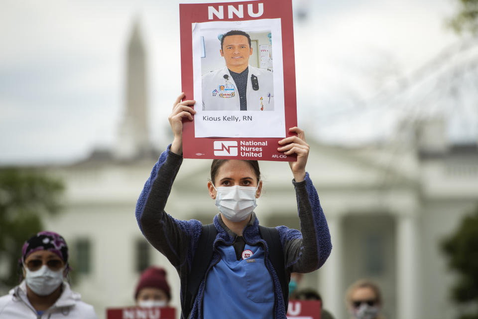 UNITED STATES - APRIL 21: Registered Nurses conduct a demonstration in Lafayette Park to read aloud names of health care providers who have contracted COVID-19 and died as a result of treating infected patients on Tuesday, April 21, 2020. The event was held by National Nurses United (NNU) to demand that health care workers be provided with the best personal protective equipment (PPE). (Photo By Tom Williams/CQ-Roll Call, Inc via Getty Images)