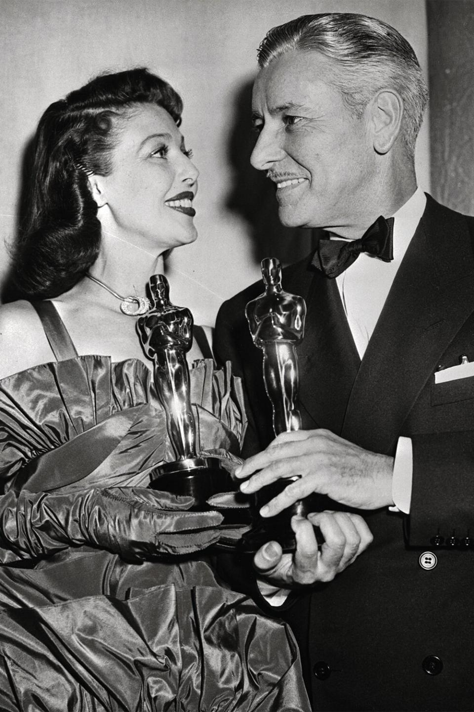 (Original Caption) Loretta Young and Ronald Colman pose with the Oscars they received as Best Actor and Actress of 1947. Miss Young received hers for her acting in The Farmer's Daughter, while Colman's acting in A Double Life earned him his Oscar.