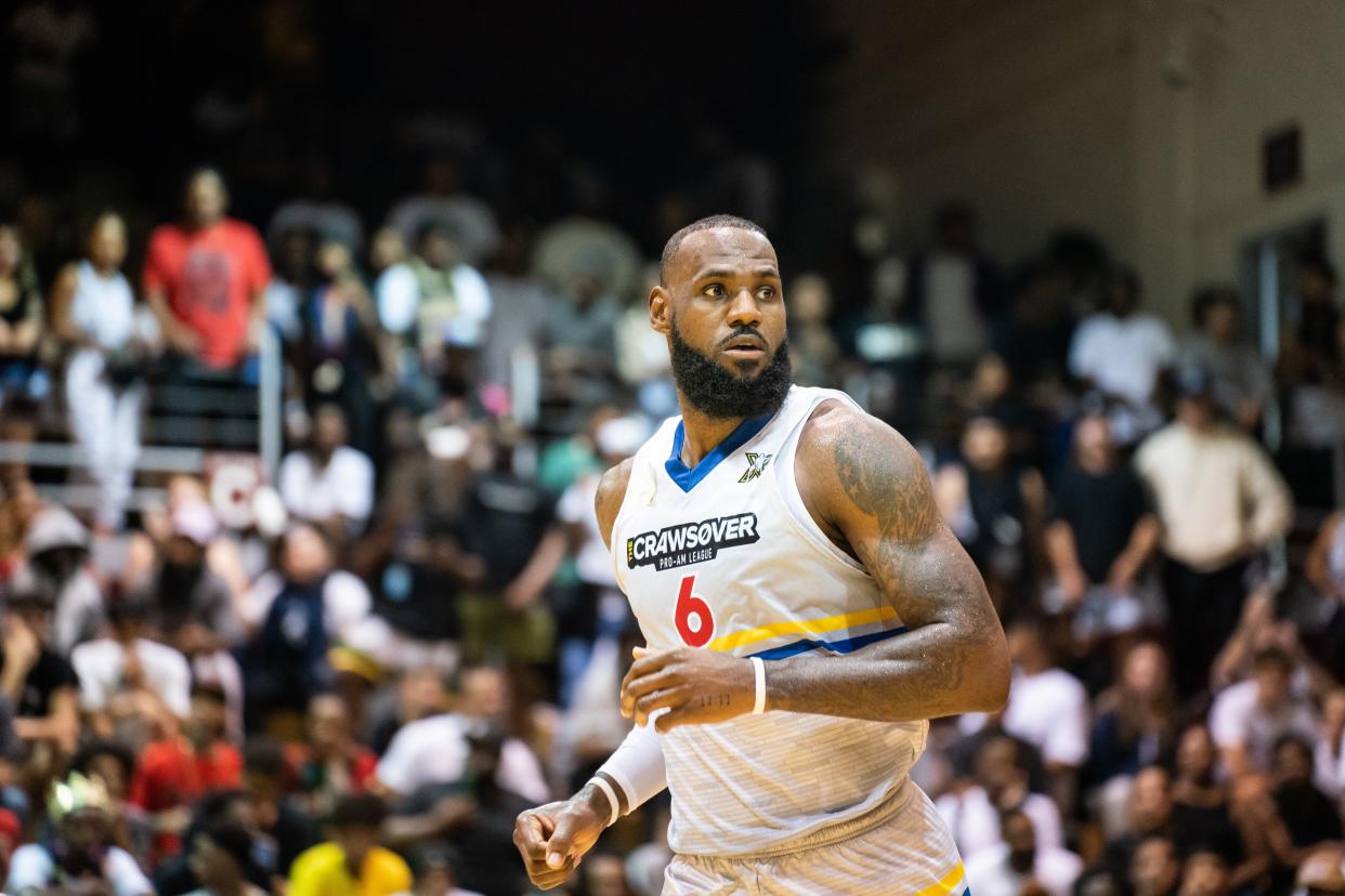 LeBron James runs down the court during the CrawsOver Pro-Am game at Seattle Pacific University on August 20, 2022 in Seattle, Washington.