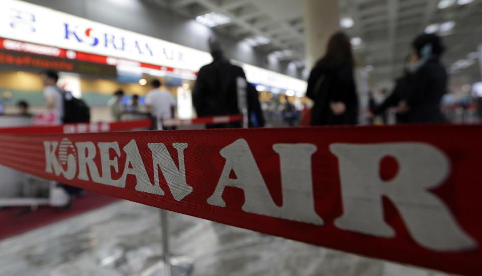 Passengers wait to buy tickets at a Korean Air ticketing counter at Gimpo airport in Seoul, South Korea, Thursday, Oct. 25, 2012. South Korea's flagship carrier Korean Air returned to profit after two straight quarters of losses as increased international passengers and a favorable exchange rate offset lower cargo shipments. (AP Photo/Lee Jin-man)