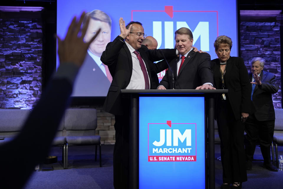 Pastor Jimmy Morales, left, prays over Jim Marchant at an event to announce Marchant's candidacy for the U.S. Senate seat in Nevada, Tuesday, May 2, 2023, in Las Vegas. Marchant, a former state Assembly member who also lost a bid for Congress three years ago, raised his national profile last year as the organizer of a coalition of 17 GOP candidates who maintained that the 2020 presidential election was stolen from Donald Trump. (AP Photo/John Locher)