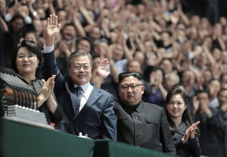 South Korean President Moon Jae-in and North Korean leader Kim Jong Un acknowledge the audience after watching the performance titled "The Glorious Country" at the May Day Stadium in Pyongyang, North Korea, September 19, 2018. Pyeongyang Press Corps/Pool via REUTERS