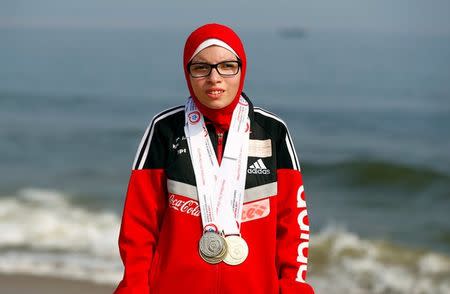 Special olympics athlete Alaa Abdelaziz wears medals on a beach in Alexandria, Egypt, July 18, 2017. REUTERS/Mohamed Abd El Ghany