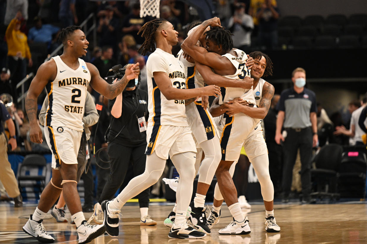 INDIANAPOLIS, IN - MARCH 18: Murray State Racers players react after defeating San Francisco Dons in an overtime period in the first round of the 2022 NCAA Men's Basketball Tournament held at Gainbridge Fieldhouse on March 18, 2022 in Indianapolis, Indiana. Murray State Racers won in overtime, 92-87. (Photo by Jamie Sabau/NCAA Photos via Getty Images)