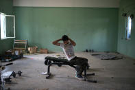 <p>16-year-old Amor Biro from Syria works out at the refugee camp of Ritsona about 86 kilometers (53 miles) north of Athens, May 26, 2017. Amor and his family wants to go to Germany. On World Refugee Day, more than 60,000 refugees and migrants are still stranded in Greece in a process barely moving: Forward to other countries of the European Union, or back to Turkey under a deportation deal launched 15 months ago. (Photo: Petros Giannakouris/AP) </p>