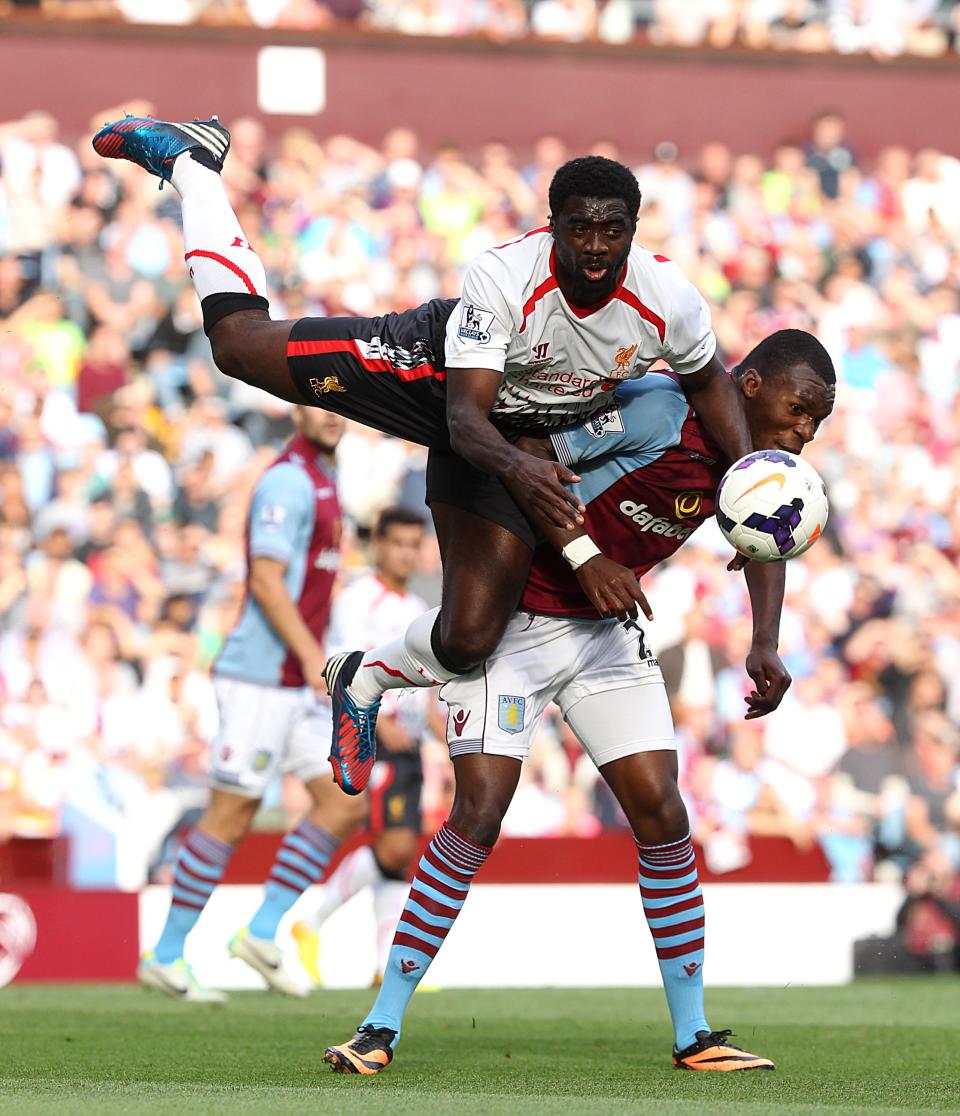 Liverpool's Kolo Toure (top) and Aston Villa's Christian Benteke (right) battle for the ball