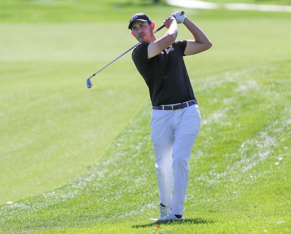 Patrick Cantlay hits an approach shot on the 5th hole during the American Express at La Quinta Country Club in La Quinta, Calif., Thursday, January 20, 2022.