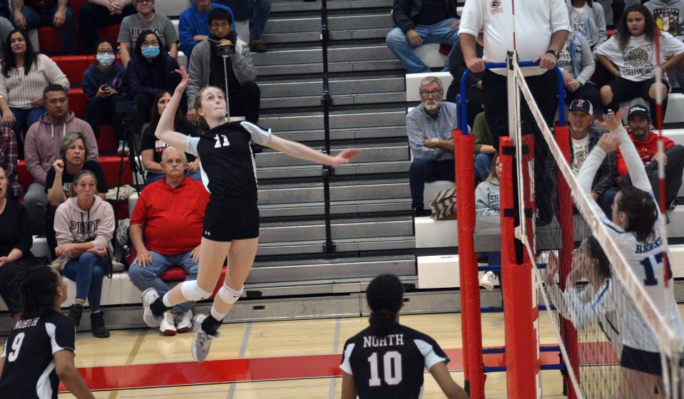 North Hagerstown's Caydence Doolan leaps to hit one of her six kills during a Maryland Class 3A volleyball quarterfinal against River Hill at North on Nov. 11, 2022.