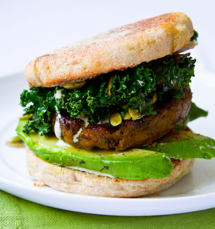 <p>This vegan breakfast sandwich is a <em>gorgeously green</em> spin on your usual morning meal. This breakfast sandwich is loaded with kale, pepitas and a flavorful veggie sausage patty.</p><p><strong>Get the recipe here: <a href="https://healthyhappylife.com/shamrock-breakfast-sandwich-kale/" rel="nofollow noopener" target="_blank" data-ylk="slk:Shamrock Breakfast Kale Sandwich;elm:context_link;itc:0;sec:content-canvas" class="link ">Shamrock Breakfast Kale Sandwich</a></strong></p>