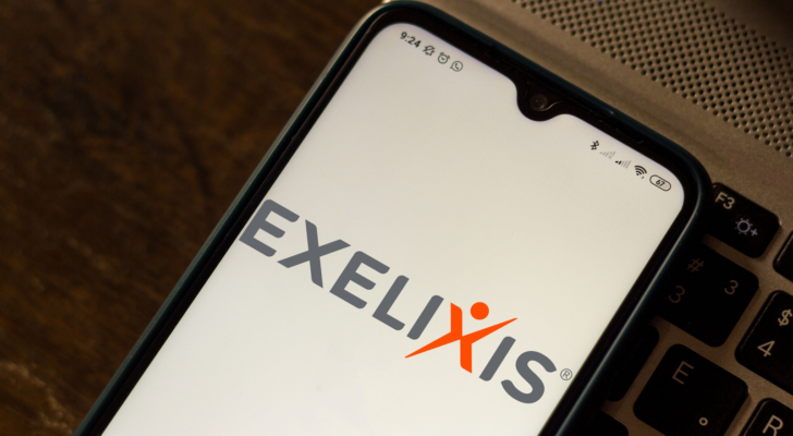 The logo for Exelixis is displayed on a phone.