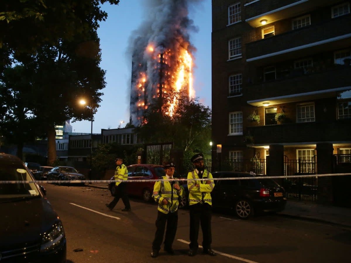 Police at the scene of the blaze in 2017 (AFP via Getty Images)