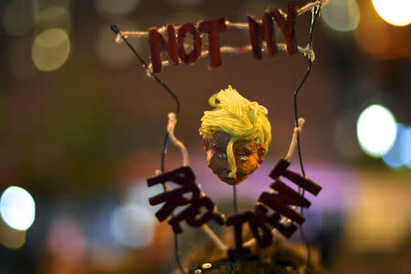 The headgear of Halle Ballard, 23, is pictured as she joins demonstrators protesting in response to the election of Republican Donald Trump as President of the United States in Philadelphia, Pennsylvania, U.S. November 11, 2016. REUTERS/Mark Makela