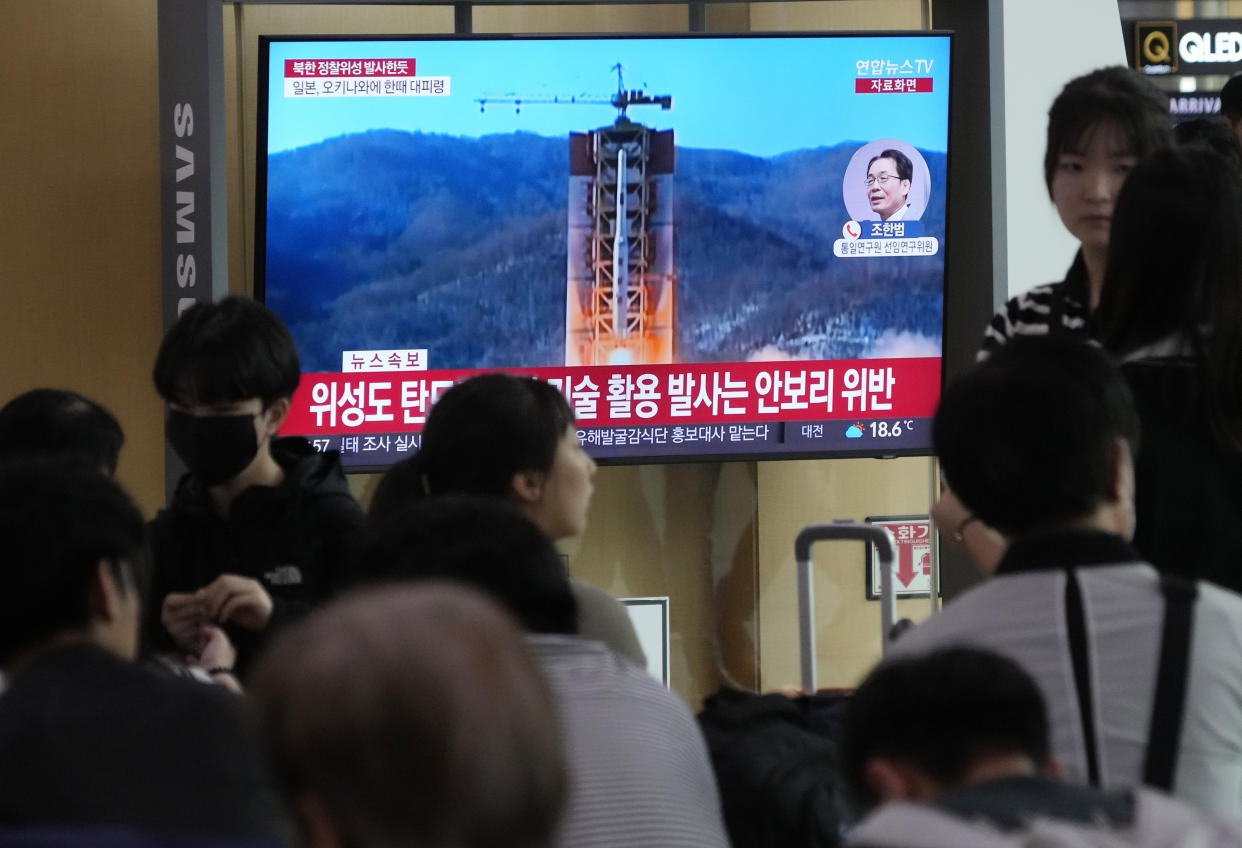 A TV screen shows a file image of North Korea's rocket launch during a news program at the Seoul Railway Station in Seoul, South Korea, Wednesday, May 31, 2023. North Korea launched a purported rocket Wednesday, a day after the country announced a plan to put its first military spy satellite into orbit, South Korea's military said. (AP Photo/Ahn Young-joon)