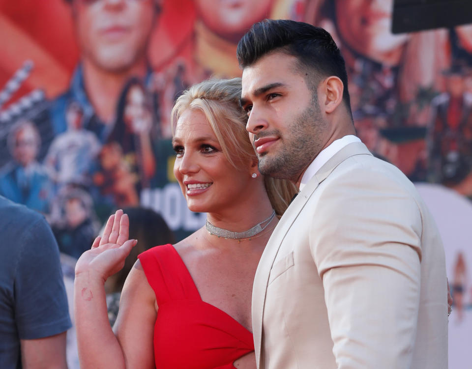 Britney Spears and Sam Asghari pose at the premiere of 