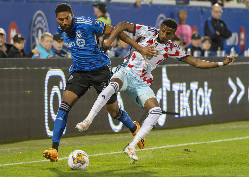 CF Montreal's George Campbell (24) and Chicago Fire's Maren Haile-Selassie battle for possession of the ball during the first half of an MLS soccer match in Montreal, Saturday, Sept. 16, 2023. (Peter McCabe/The Canadian Press via AP)