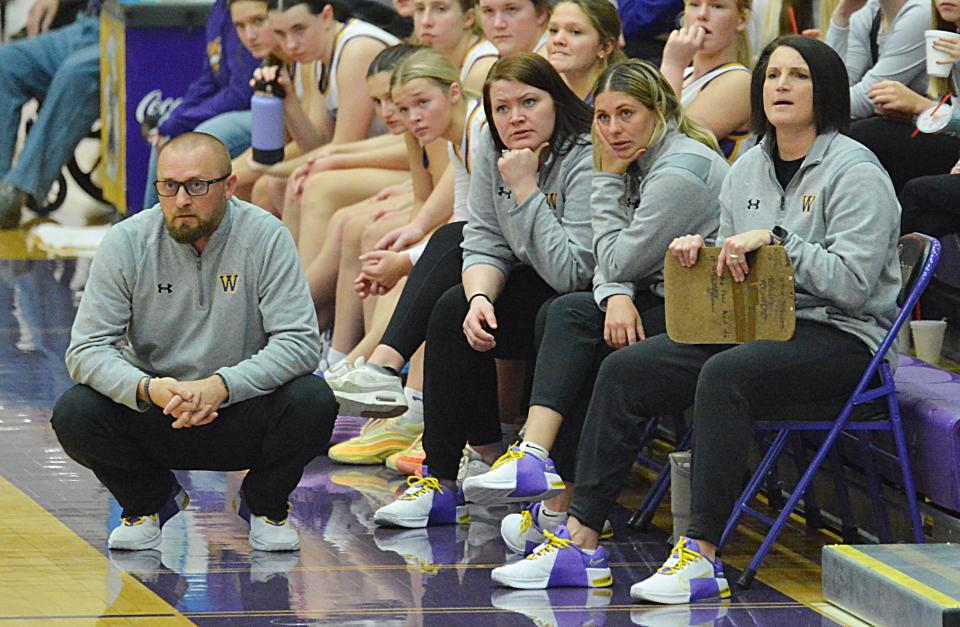 Watertown head coach Chad Rohde (left) and assistants, from left, Mackenzie Buelow, Elli Stevenson and Stacey Hendricks watch the action during a high school girls basketball game against Aberdeen Central on Tuesday, Jan. 9, 2024 in the Watertown Civic Arena. Aberdeen Central won 41-35.