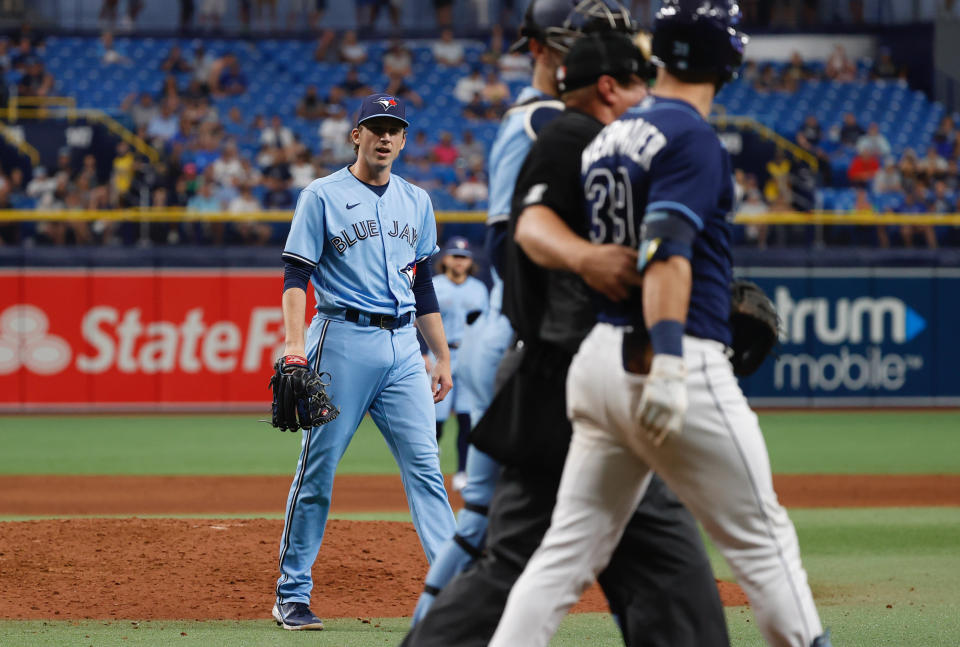 Sep 22, 2021; St. Petersburg, Florida, USA; Toronto Blue Jays pitcher Ryan Borucki (56)  reacts after he throws a pitch that hits Tampa Bay Rays center fielder Kevin Kiermaier (39) during the eighth inning at Tropicana Field. Mandatory Credit: Kim Klement-USA TODAY Sports - 16806188