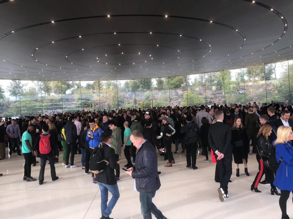 The press gather at the Steve Jobs Theater for Apple's `Showtime' media event.