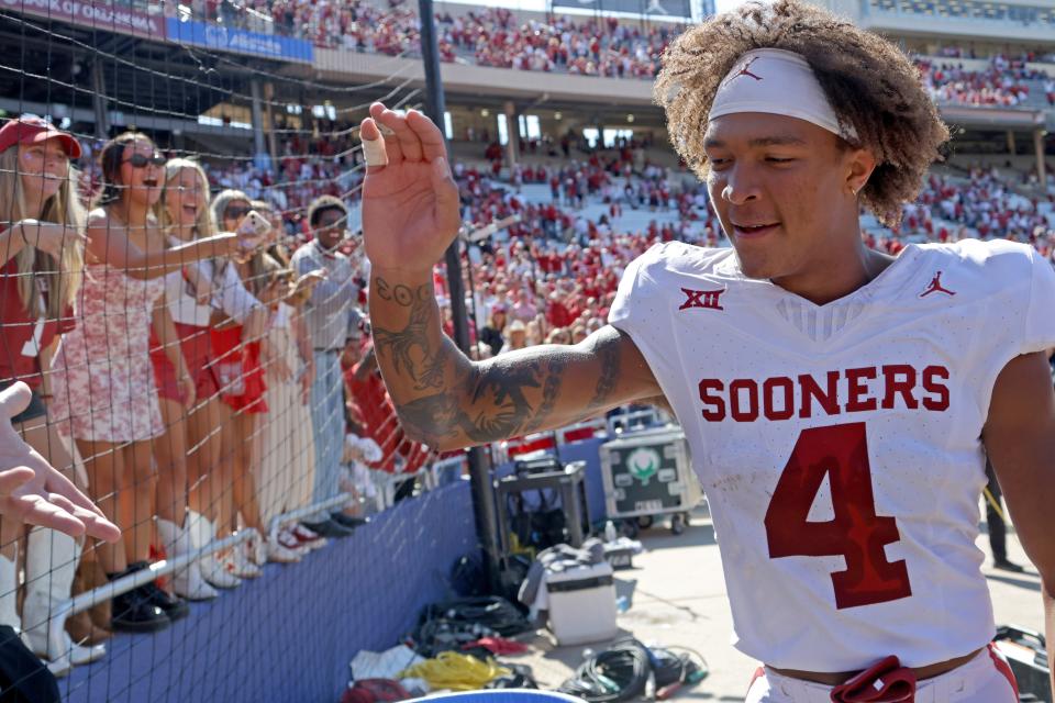 Oklahoma Sooners wide receiver Nic Anderson (4) celebrates with fans after the Red River Rivalry college football game between the University of Oklahoma Sooners (OU) and the University of Texas (UT) Longhorns at the Cotton Bowl in Dallas, Saturday, Oct. 7, 2023. Oklahoma won 34-30.