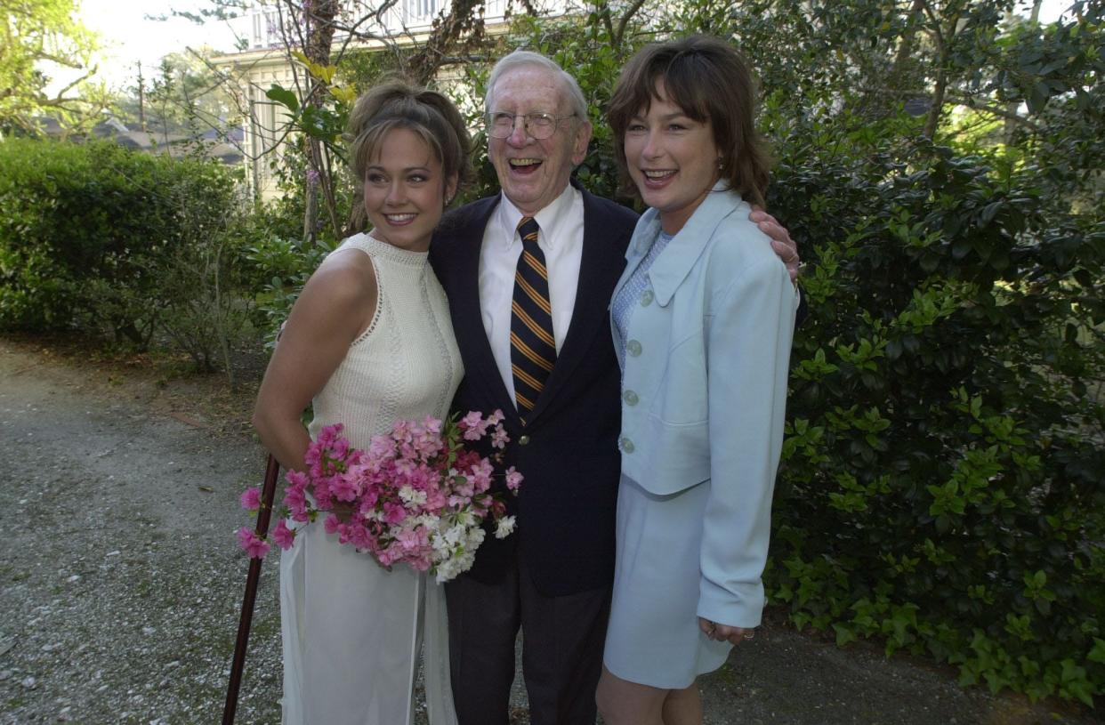 2001 Queen Azalea Nikki DeLoach (left) with Henry Rehder and 2000 Queen Azalea in Rehder's garden in 2001.