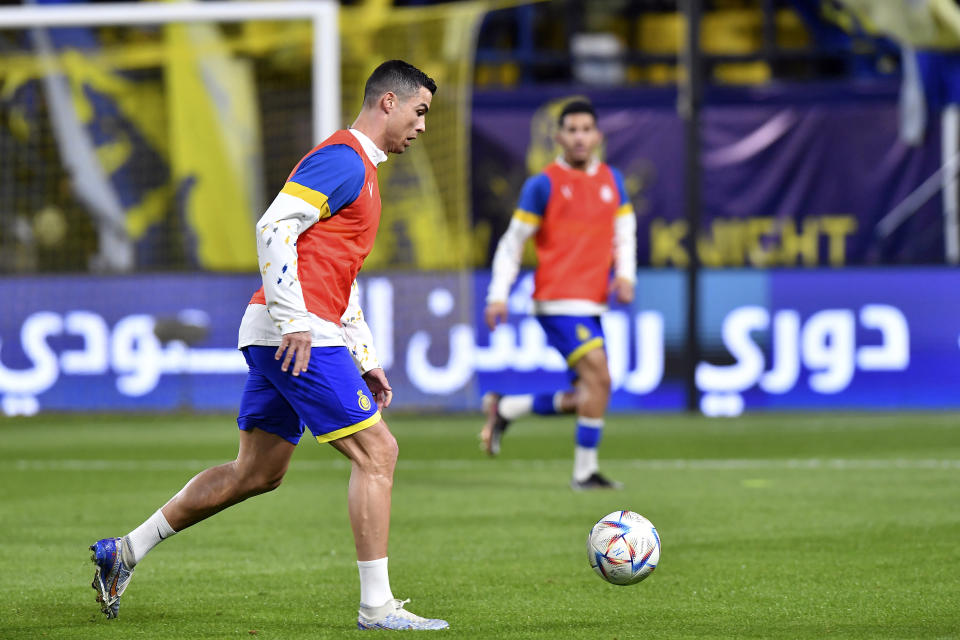 Al Nassr player Cristiano Ronaldo warms up before his team match against Al Ettifaq, in the Saudi Pro League at Mrsool Park Stadium, in Riyadh, Saudi Arabia, Sunday, Jan. 22, 2023. (AP Photo)