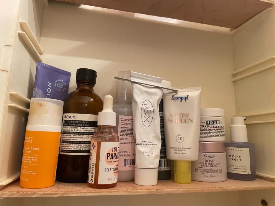 Emma Ginsberg's skincare products in a medicine cabinet