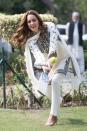 <p>The duchess takes a swing during a game of cricket in Lahore, Pakistan.</p>