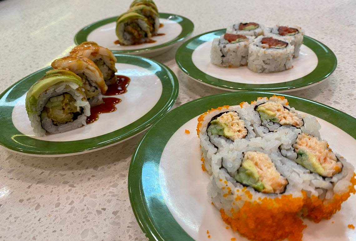 A “red” California roll, spicy tuna roll, “Caterpillar” roll and “Tiger” roll at Akarii Revolving Sushi.