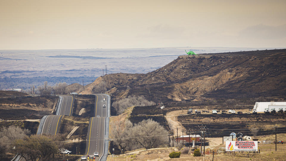 Aud the Dinosaur still stands after the Smokehouse Creek fire, on Thursday, Feb. 29, 2024, in Canadian, Texas. (AP Photo/David Erickson)