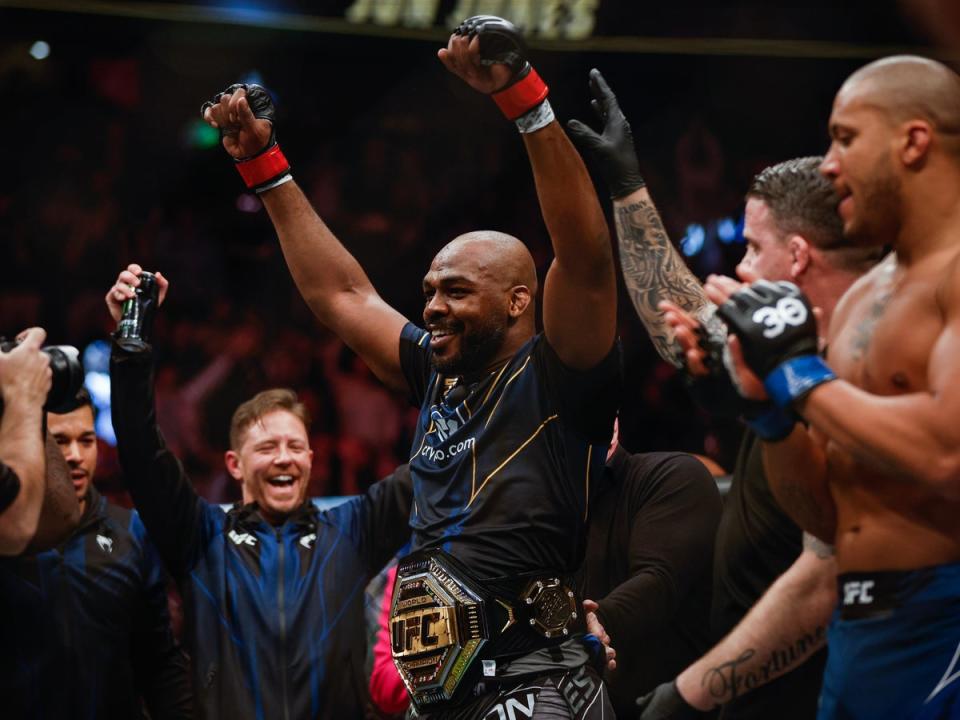 Jones celebrates becoming a two-division UFC champion (Getty Images)