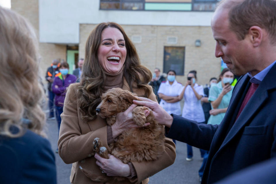 The Duchess of Cambridge holds a therapy puppy during her visit to Clitheroe Community Hospital. (Getty)  