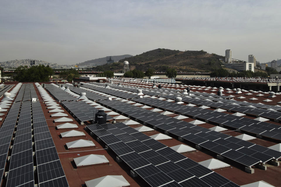 View of solar panels installed by Pireos Power on the roof of a warehouse in the state of Mexico, Wednesday, April 13, 2022. (AP Photo/Marco Ugarte)