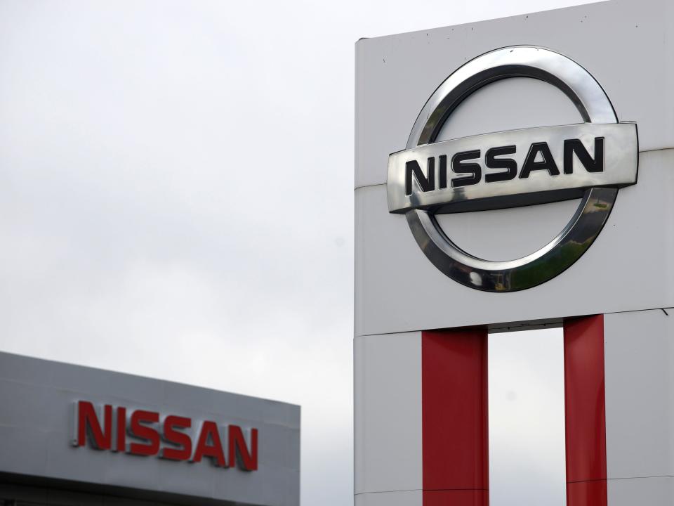 FILE PHOTO: Nissan signs are seen outside a Nissan auto dealer in Broomfield, Colorado October 1, 2014.  REUTERS/Rick Wilking 