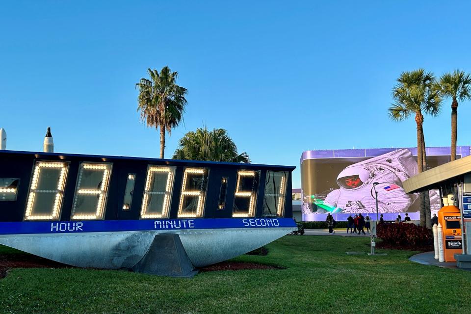 The Kennedy Space Center Visitors Complex countdown clock ticks down the minutes to tonight's SpaceX Falcon Heavy USSF-52 rocket launch.