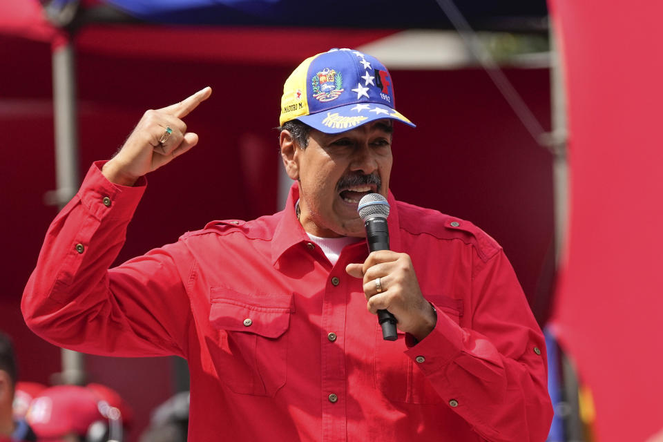 File - Venezuela's President Nicolas Maduro speaks to supporters during an event marking the anniversary of the 1992 failed coup led by late President Hugo Chavez, at the Miraflores Presidential palace in Caracas, Venezuela, Feb. 4, 2024. A Venezuelan businessman who helped hide almost $17 million in bribe payments by an ally of President Nicolas Maduro was sentenced to six months in prison Friday, Feb. 16, 2024, by a federal judge. (AP Photo/Matias Delacroix)