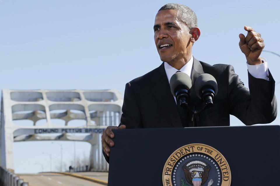 U.S. President Barack Obama delivers remarks at the Edmund Pettus Bridge in Selma, Alabama, March 7, 2015. With a nod to ongoing U.S. racial tension and threats to voting rights, Obama declared the work of the Civil Rights Movement advanced but unfinished on Saturday during a visit to the Alabama bridge that spawned a landmark voting law. REUTERS/Jonathan Ernst (UNITED STATES - Tags: POLITICS ANNIVERSARY SOCIETY)