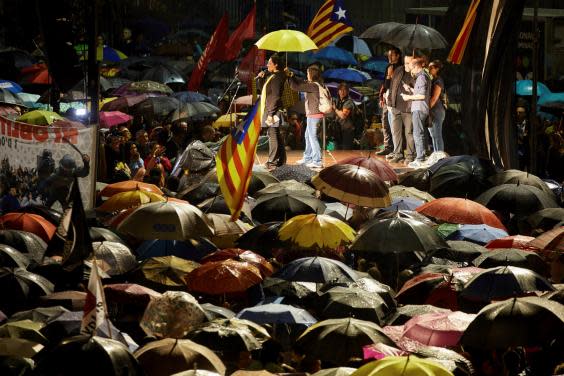 People attend a protest in Girona against the sentencing of independence leaders (EPA)