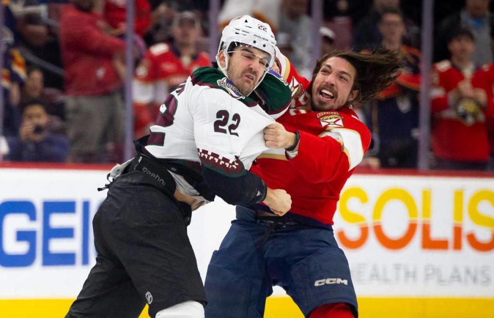 Florida Panthers left wing Ryan Lomberg (94) hits Arizona Coyotes center Jack McBain (22) during the first few seconds of the game on Wednesday, Jan. 24, 2024, at Amerant Bank Arena in Sunrise, Fla.