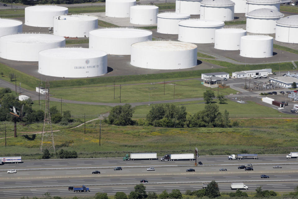 In this September 20, 2016, photo vehicles are seen near Colonial Pipeline in Helena, Alabama. The major pipeline that transports fuels along the East Coast says it had to stop operations because it was the victim of a cyber intrusion. / Credit: AP Photo/Brynn Anderson