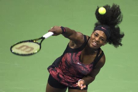 Serena Williams of the U.S. serves to Vitalia Diatchenko of Russia during their match at the U.S. Open Championships tennis tournament in New York, August 31, 2015. REUTERS/Adrees Latif