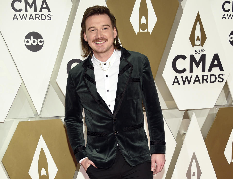 FILE - Morgan Wallen arrives at the 53rd annual CMA Awards on Nov. 13, 2019, in Nashville, Tenn. Wallen will still be eligible for multiple awards at this year's CMA Awards, but not the show's top prize. The disgraced country singer apologized after he was caught on camera using a racial slur in February. The Country Music Association's Board of Directors voted that Wallen won't be eligible for individual artist awards, such as entertainer of the year and male vocalist. (Photo by Evan Agostini/Invision/AP, File)
