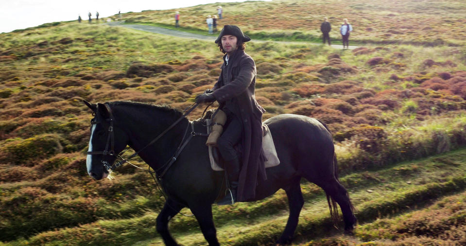 <p>Aidan Turner rides over heathland on Gwennap Head on the Cornish coast during filming for series three of the BBC One hit Sunday night drama Poldark. (Tom Leese/PA Wire) </p>