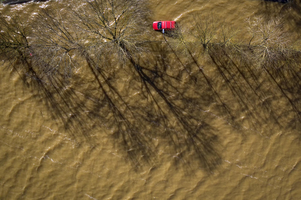 WORCESTER, ENGLAND - FEBRUARY 27:  A car is surrounded by water as floodwaters persist in the centre of Worcester City after the River Severn burst its banks on February 27, 2020 in Worcester, England. Flooding levels are decreasing after storms Ciara and Dennis, however forecasters are predicting more rain and 70mph winds this weekend from storm Jorge. (Photo by Christopher Furlong/Getty Images)