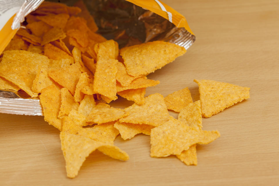 A bag of Doritos spilling out onto a table