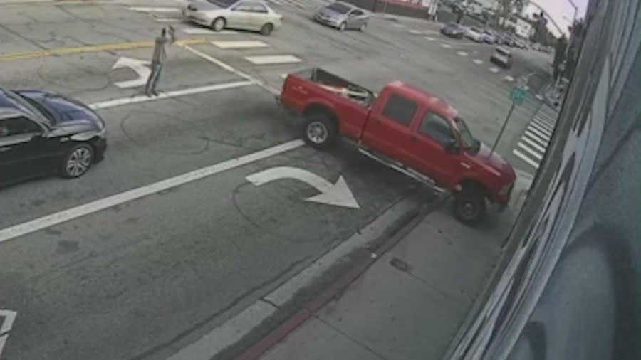 Surveillance video captures the frightening moment a pickup truck crashes through a West Hollywood barber shop, narrowly missing customers inside on Nov. 16, 2023. (Trendsetters Barbershop)