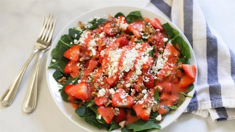 Strawberry walnut salad in white bowl