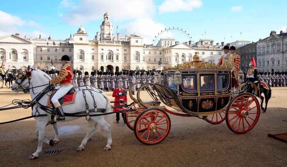 South Africa's President Cyril Ramaphosa rides with Britain's King Charles III and Britain's Camilla, Queen Consort in the Irish State Coach, as they leave from Horse Guards Parade, headed to Buckingham Palace