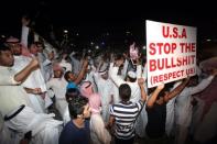 Kuwaitis protest near the US embassy in Kuwait City on September 13. The US boosted security at its embassies amid fears that more anti-American violence sparked by a film mocking Islam could erupt after Friday's Muslim prayers across the Middle East and North Africa