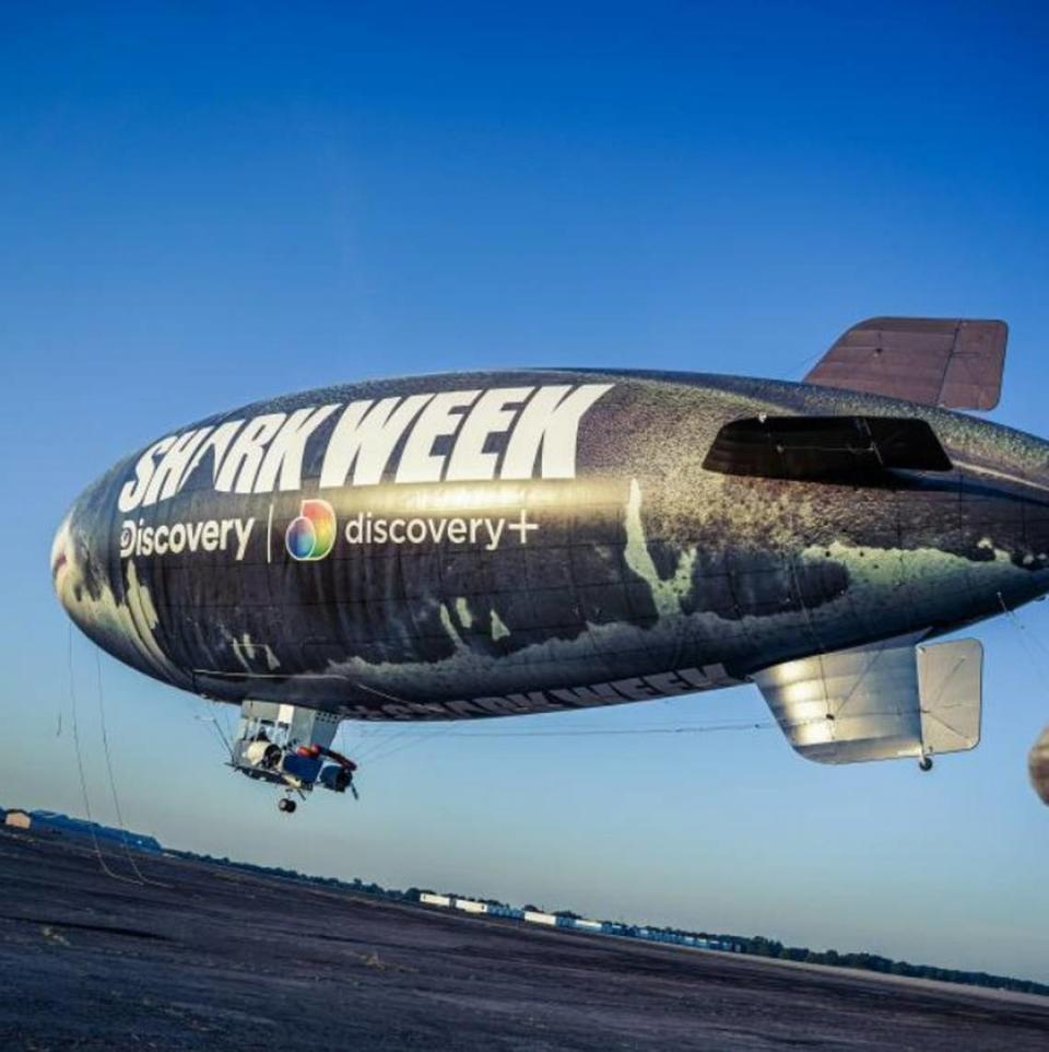 Discovery Channel will launch two blimps on the East and West Coasts to promote Shark Week, which begins July 24, 2022.